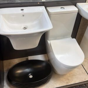 Ensemble lavabo et WC blanc avec vasque ovale noire